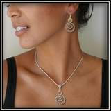 Ripples Fossilized Walrus Ivory Pendant with Peridot