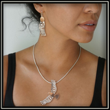 Circling the Sky Fossilized Walrus Ivory and Silver Eagle Pendant